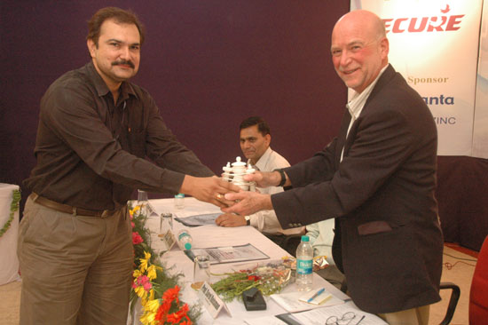 Mr. Naveen Choudhary presenting a souvenir to Prof. Sorel Reisman | ETNCC 2011